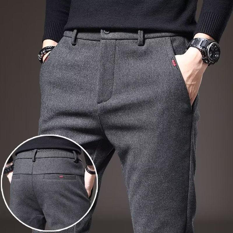 Close-up of man wearing grey wool blend slim fit casual trousers with front and back pockets