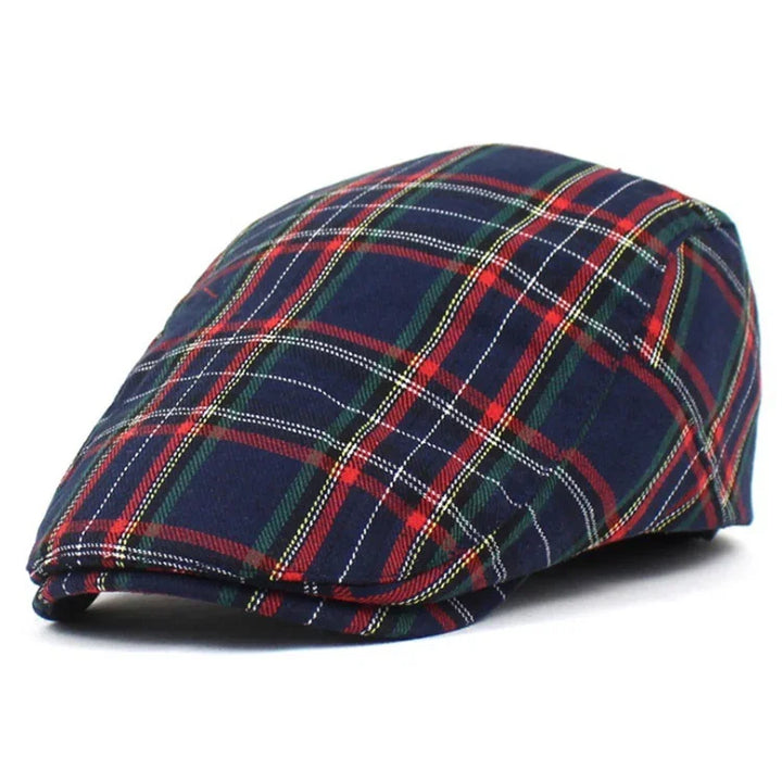 Navy blue flat cap with red, green, yellow, and white plaid pattern on white background