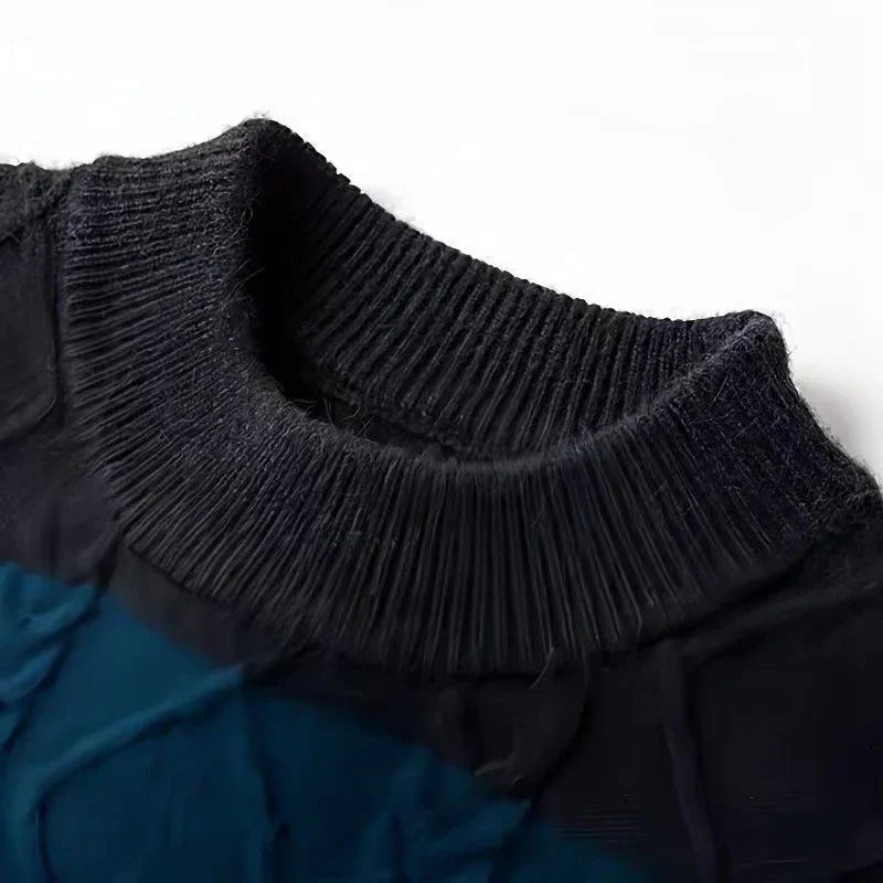 Close-up of a black ribbed knit turtleneck collar on a dark garment against white background