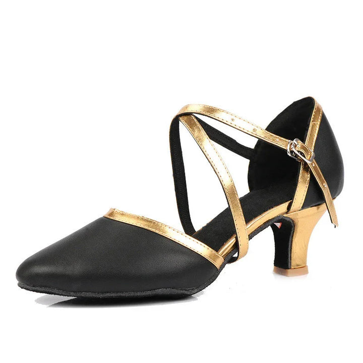 Black and gold women's dance shoe with low heel and cross straps on white background