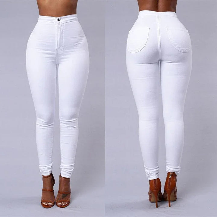 Front and back view of woman wearing high-waisted white skinny jeans with brown high heel sandals