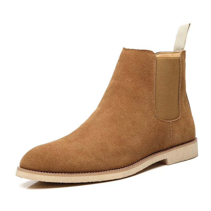 tan suede Chelsea boot with elastic side panel and beige sole on white background