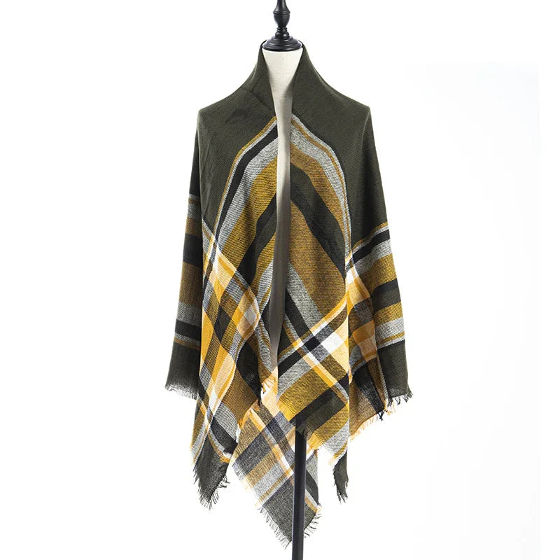 Plaid shawl in mustard yellow, olive green, black, and white on mannequin