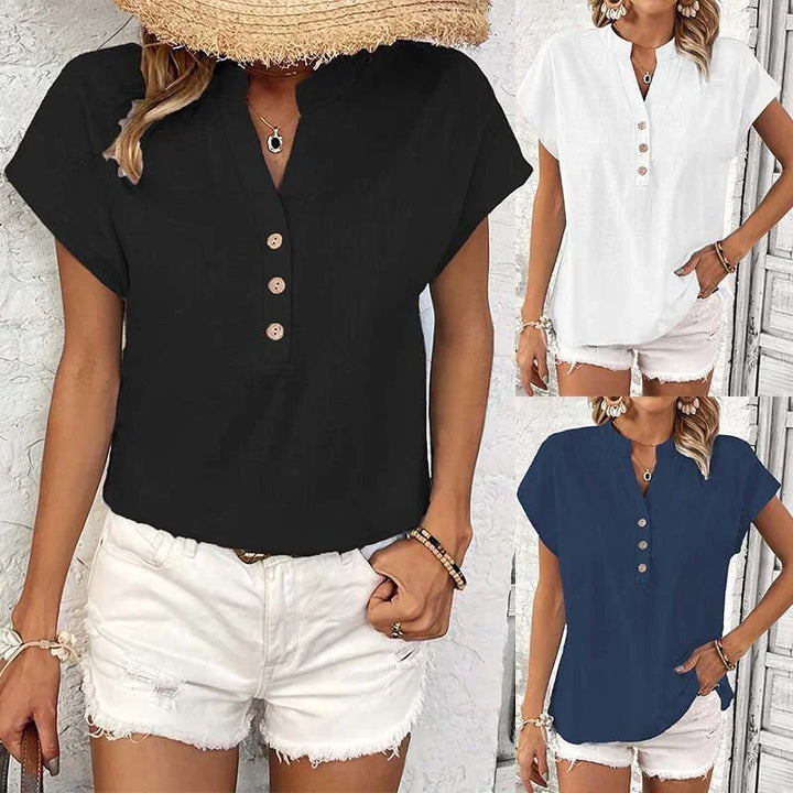 Women wearing casual summer tops in black, white, and navy with button details paired with white shorts