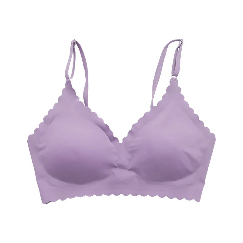 Lavender seamless bra with scalloped edges and adjustable straps on white background