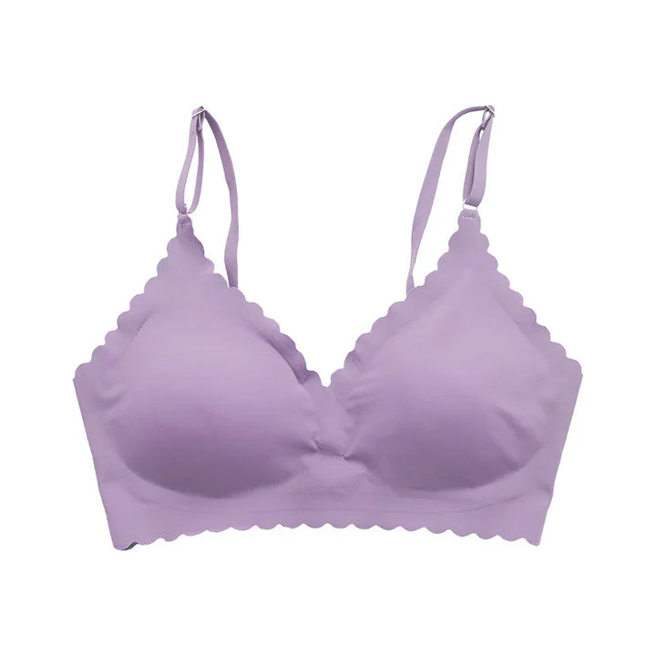 Lavender seamless bra with scalloped edges and adjustable straps on white background