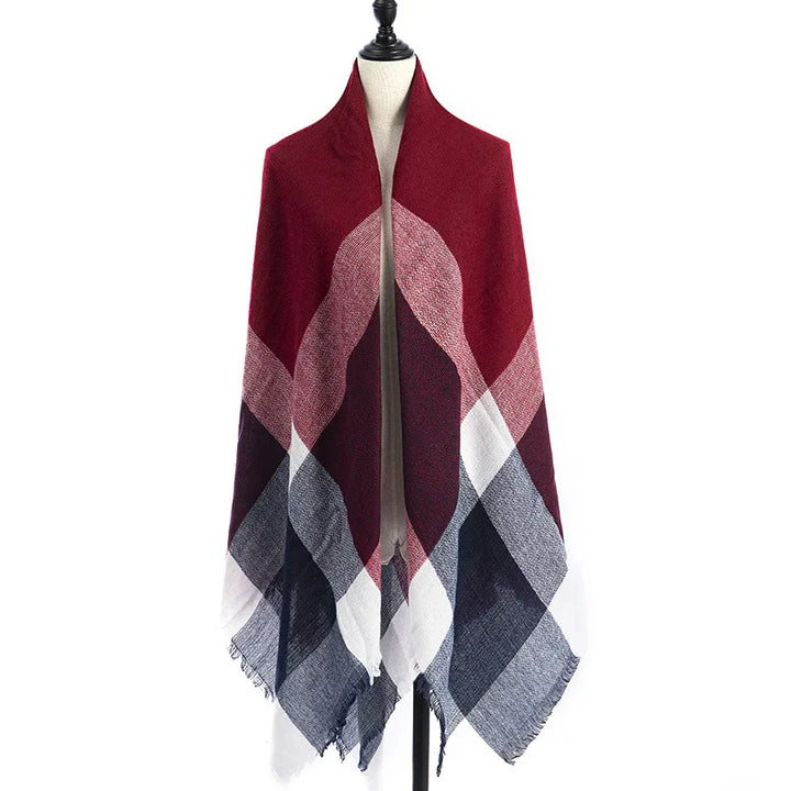 Red, white, and navy blue geometric patterned wool scarf displayed on mannequin