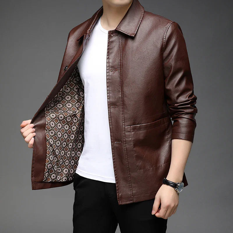 man wearing brown leather jacket with patterned inner lining over white shirt and black pants