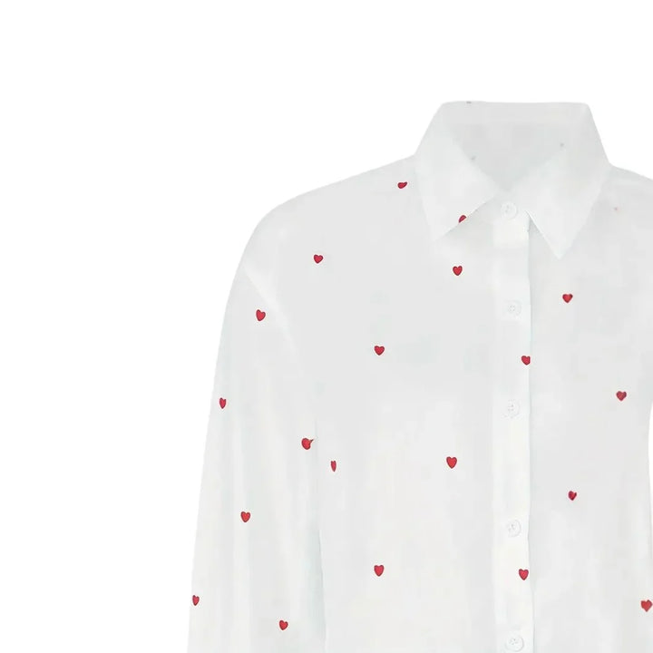 White button-up shirt with small red heart prints, classic collar, and long sleeves