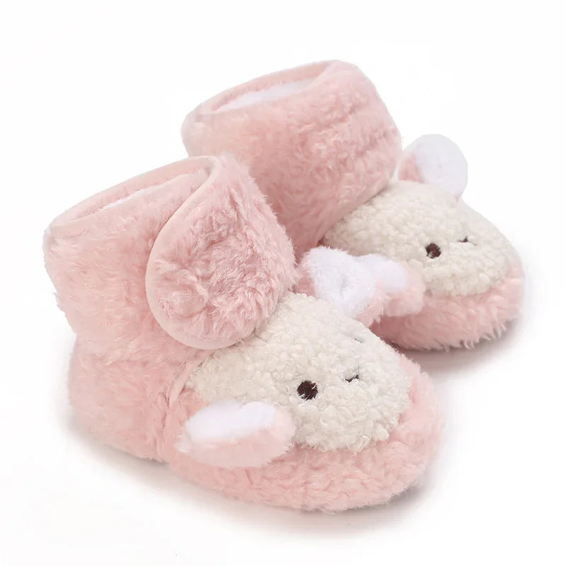 Soft pink baby slippers with plush lamb faces and ears, cozy and cute infant footwear