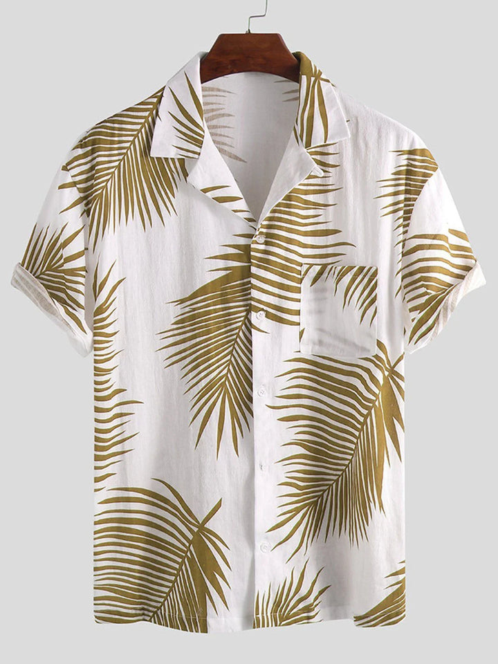 White short-sleeve button-up shirt with olive green palm leaf print and front pocket