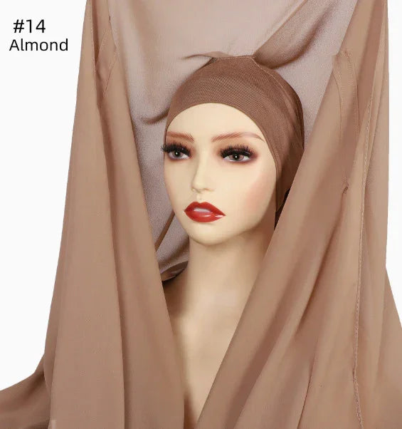 Mannequin head wearing almond-colored inner hijab cap with matching flowing fabric