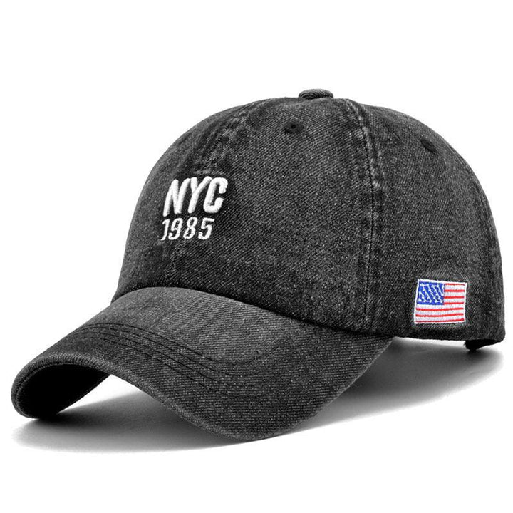 Black denim baseball cap with embroidered NYC 1985 and small American flag patch