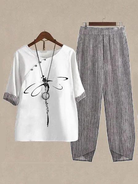 Women's casual outfit with white top featuring dragonfly print and striped gray pants on beige background