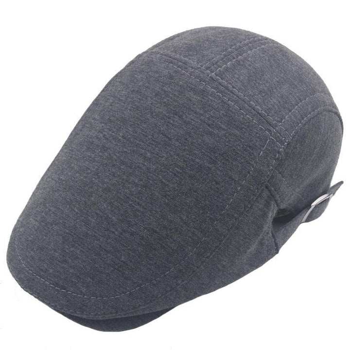 Gray flat cap with visible stitching and adjustable strap on white background