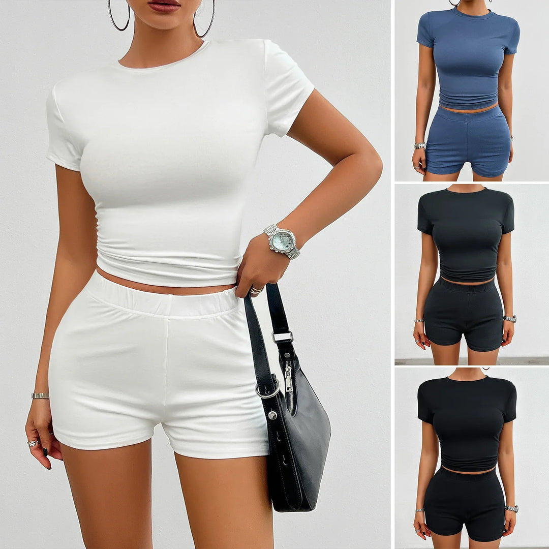 Women wearing casual short sleeve crop top and matching shorts sets in white, blue, and black colors