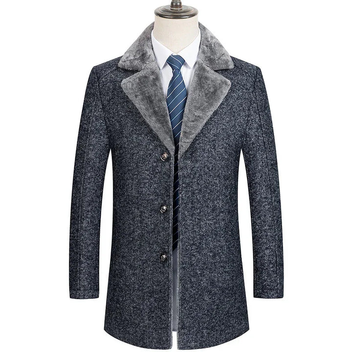 Men's grey wool blend winter coat with plush grey collar, white dress shirt, and blue striped tie