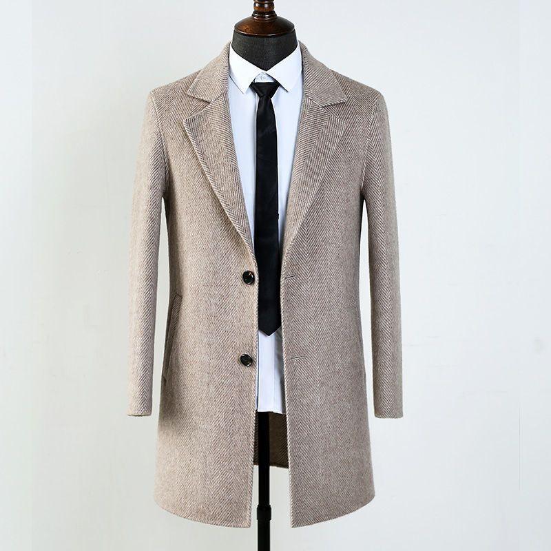 Men's beige herringbone wool coat on mannequin with white shirt and black tie