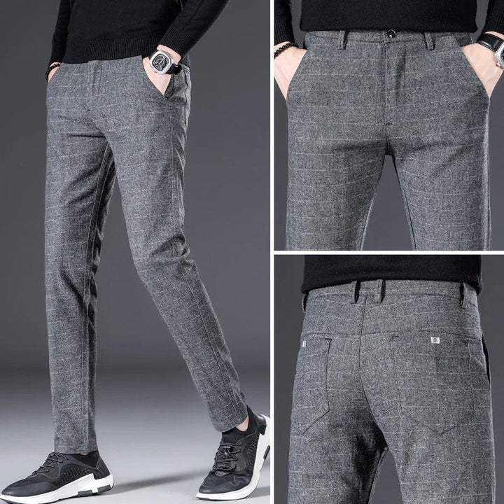 Men's slim fit gray plaid dress pants styled with black sweater and sneakers