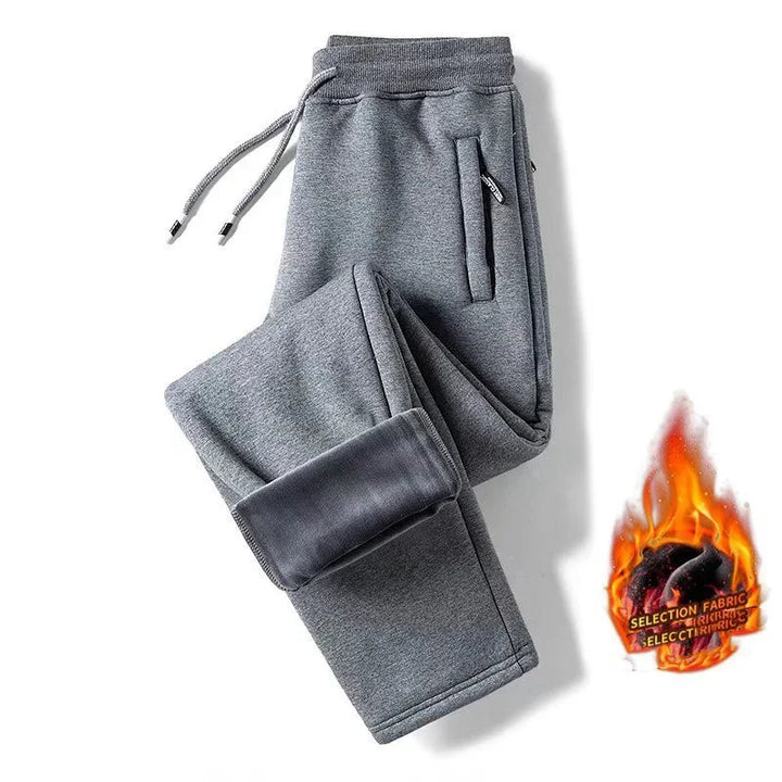 Gray fleece-lined sweatpants with drawstring waist and zippered pockets, warm winter fabric