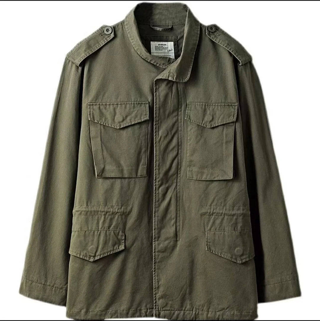 Olive green military jacket with buttoned shoulder epaulets and four front flap pockets