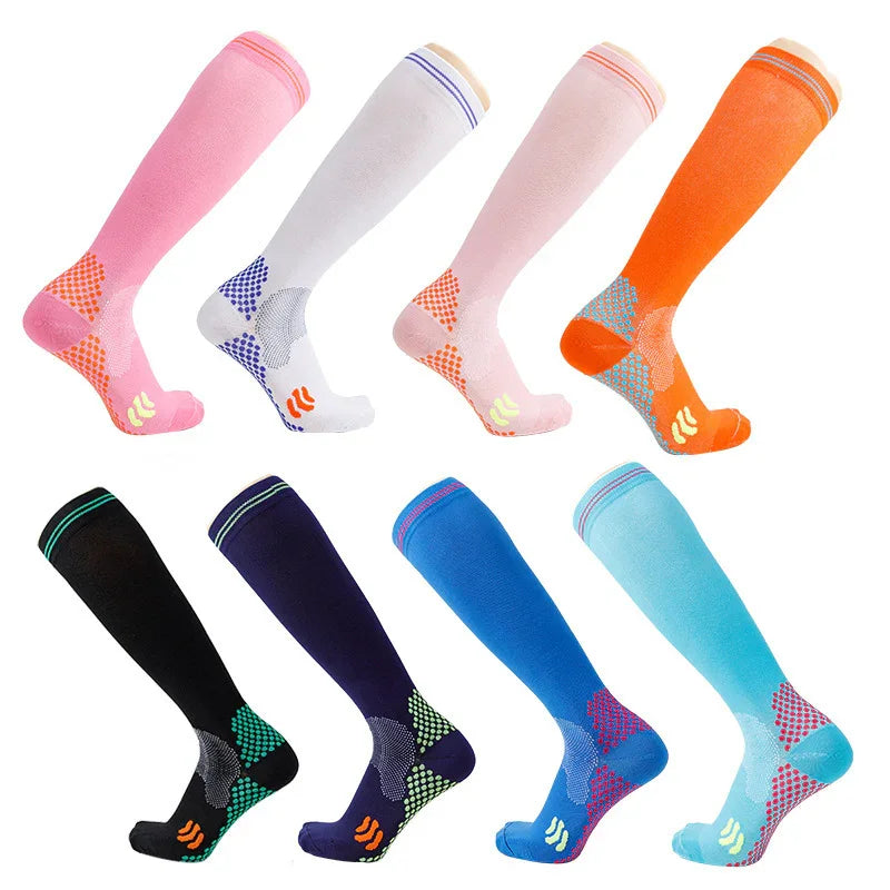 Eight pairs of colorful knee-high compression socks in pink, white, orange, black, navy, blue, and teal with grip patterns