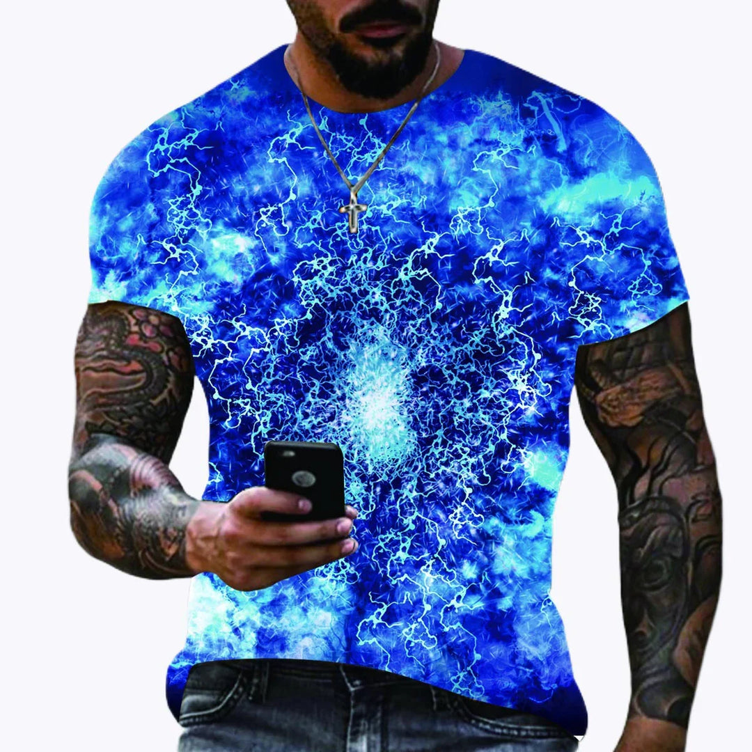 Man wearing blue electric lightning graphic t-shirt with tattooed arms holding smartphone