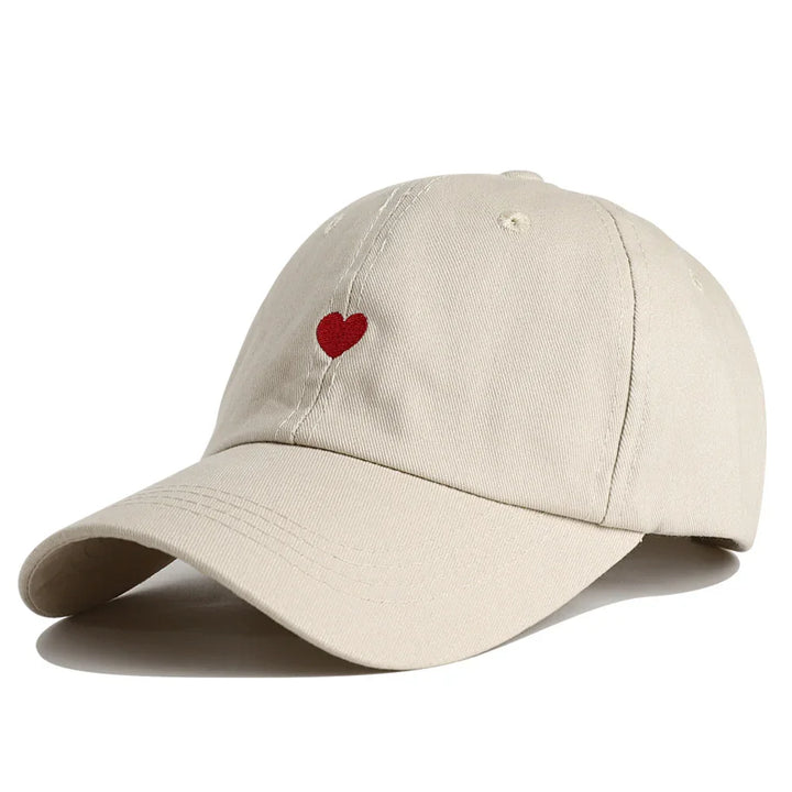 Beige baseball cap with red heart embroidery on front panel, casual adjustable hat