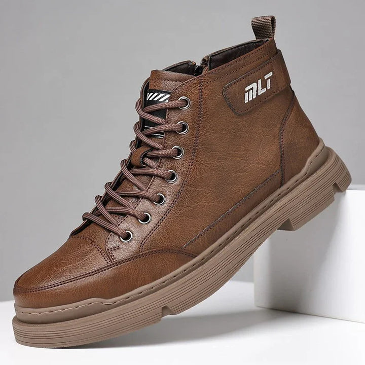 Brown leather high-top casual sneaker with laces and thick rubber sole on gray background