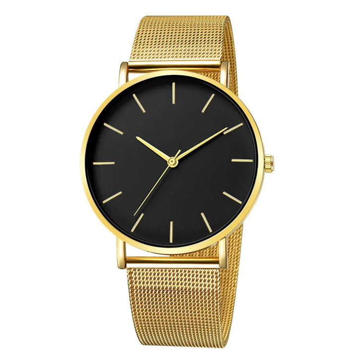 Gold mesh band wristwatch with black minimalist dial and gold hour markers and hands