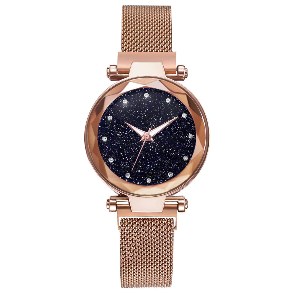Rose gold mesh band wristwatch with starry dark blue glitter dial and crystal hour markers