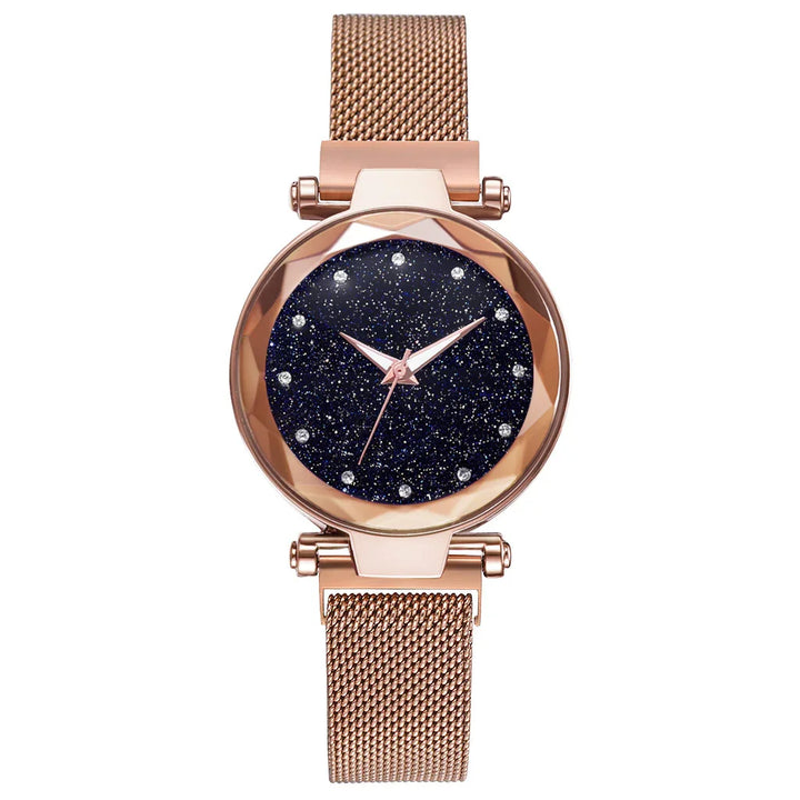 Rose gold mesh band wristwatch with starry dark blue glitter dial and crystal hour markers