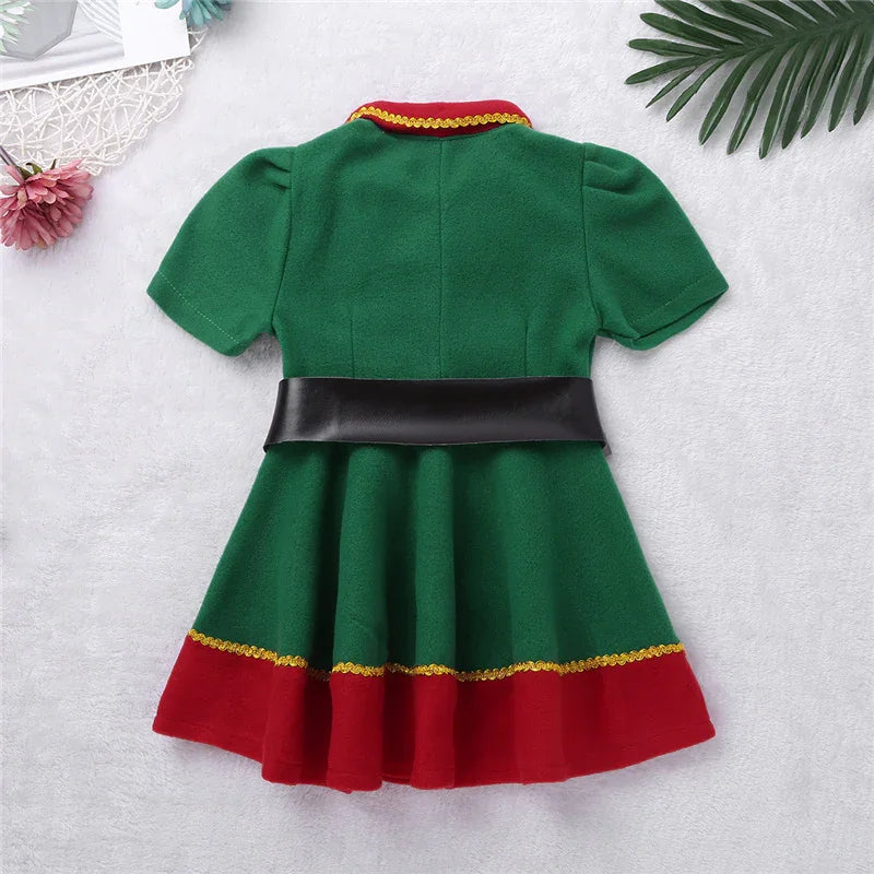 Green and red toddler dress with puff sleeves, black belt, and gold trim on a white background