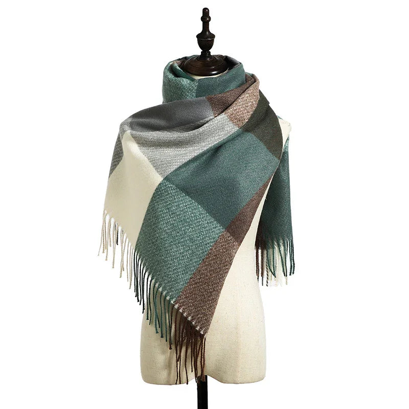 Plaid green and brown wool scarf with fringes displayed on mannequin