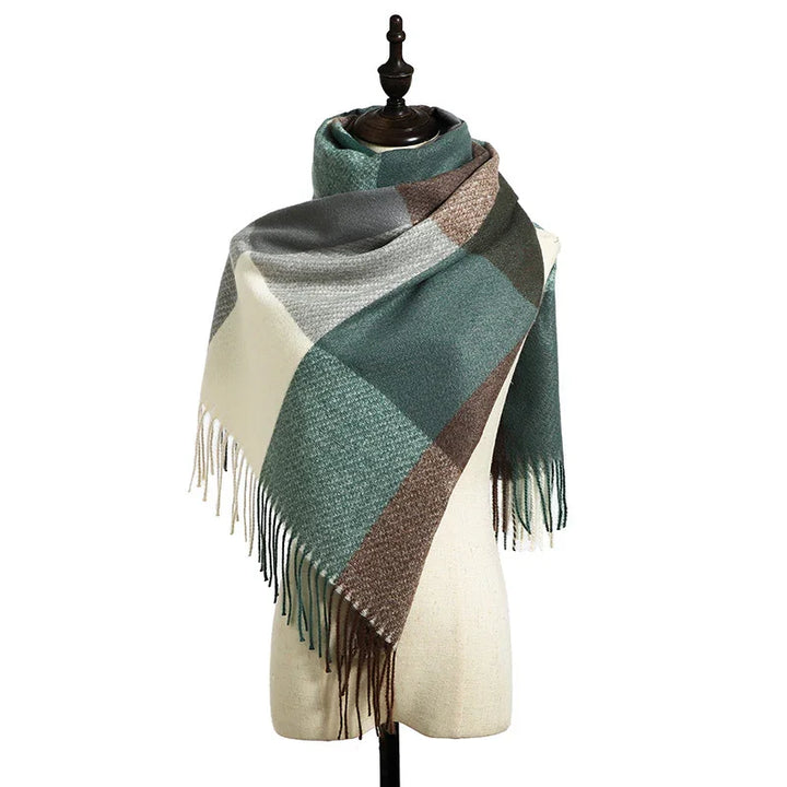Plaid green and brown wool scarf with fringes displayed on mannequin