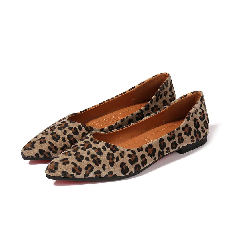 Pair of women's leopard print pointed toe flat shoes with tan interior and black sole