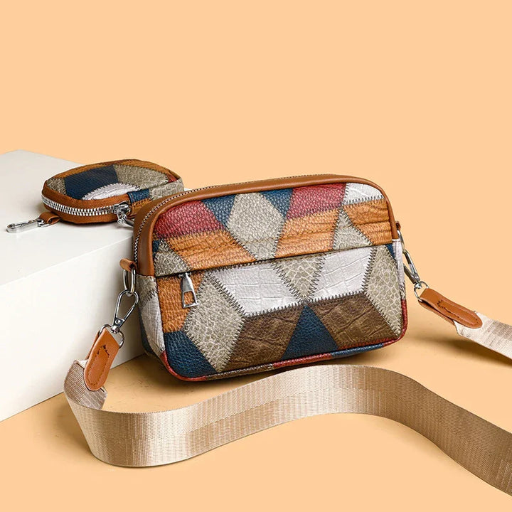 Patchwork leather crossbody bag with geometric pattern and detachable beige strap on peach background