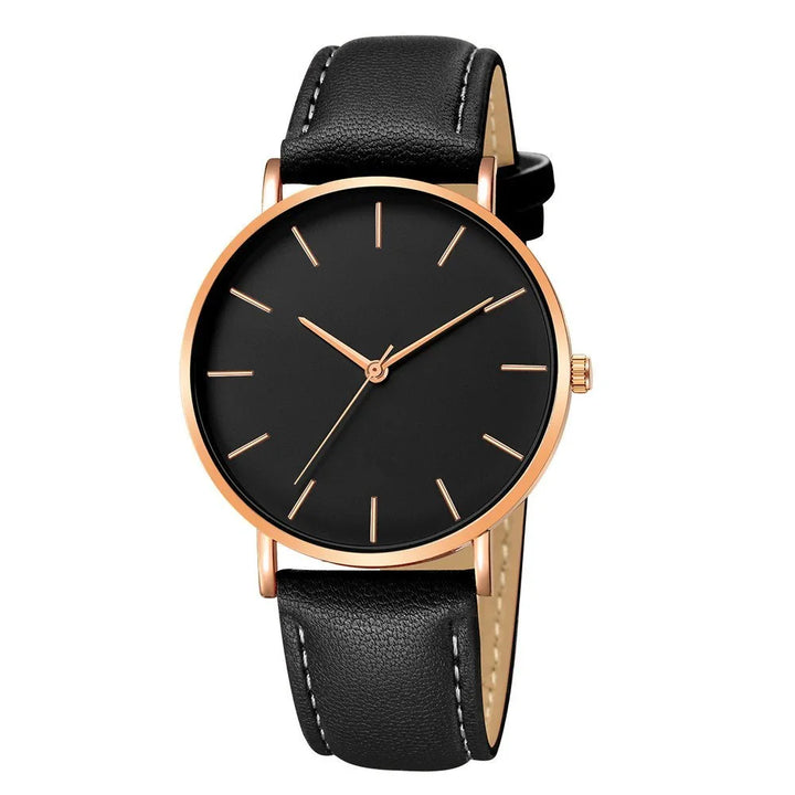 Minimalist black dial wristwatch with rose gold case and black leather strap