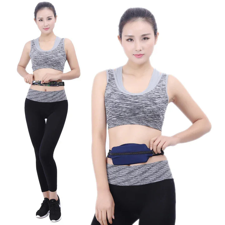 Woman in gray sports bra and black leggings wearing a blue running waist pouch with zipper