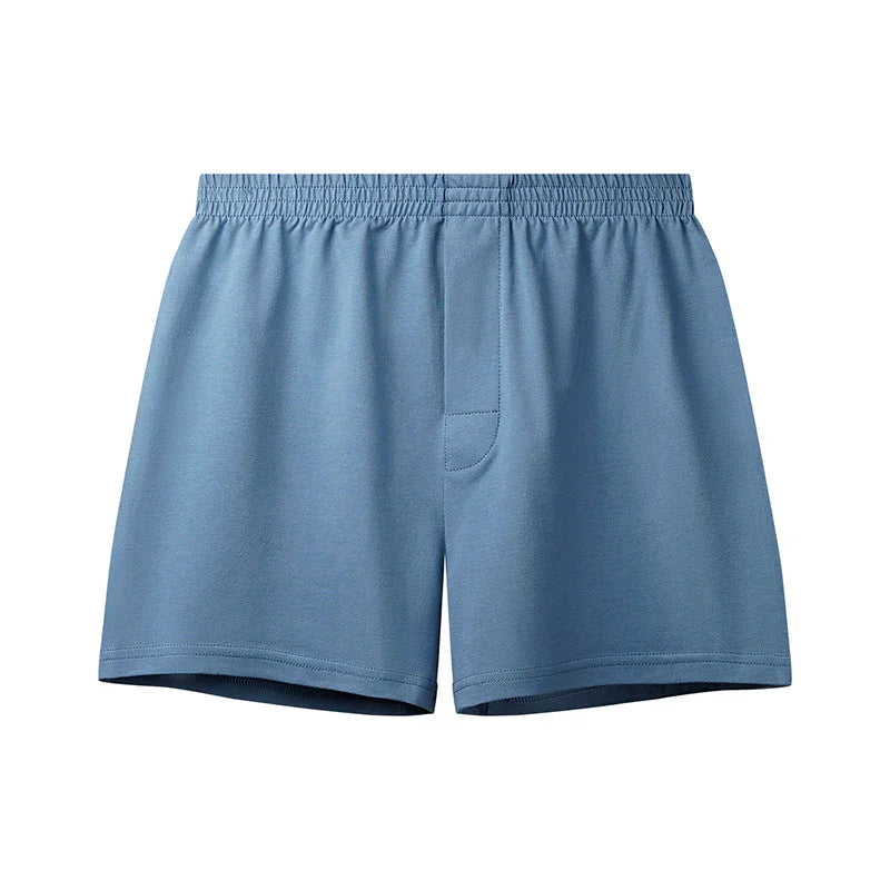 Men's light blue cotton boxer shorts with elastic waistband and front fly detail