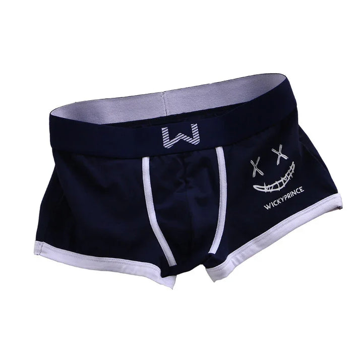Black men's boxer briefs with white trim, crossed-out eyes smiley face, and WICKYPRINCE text