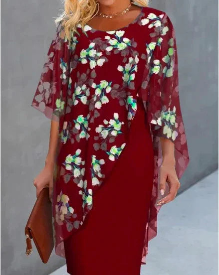 Woman wearing a red dress with sheer floral overlay and holding a brown clutch purse