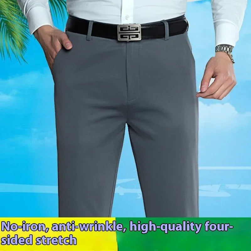 Man wearing gray formal pants with black belt and white shirt, tropical background, wrinkle-free stretch fabric