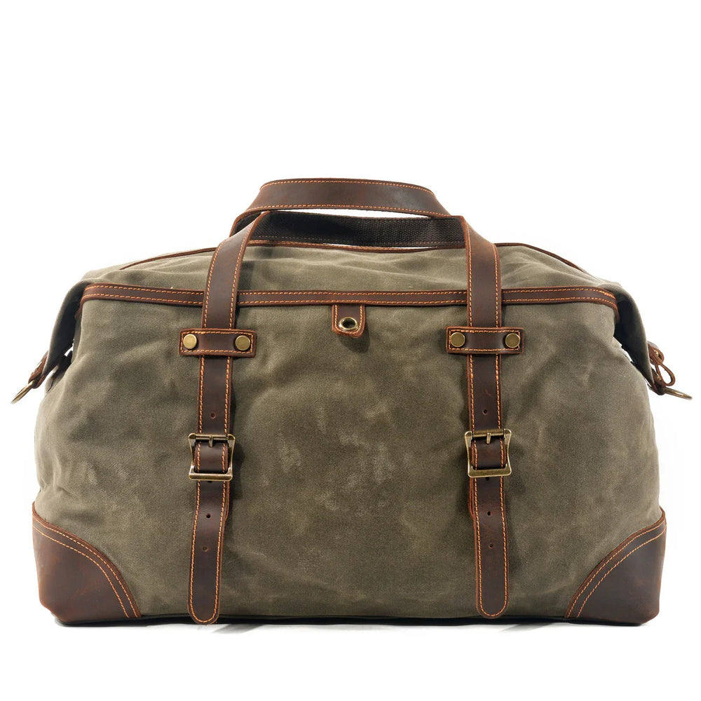 Khaki canvas and brown leather travel duffel bag with buckle straps and handles