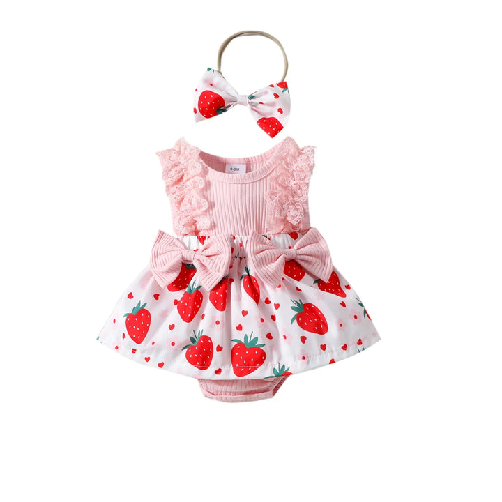 Baby girl's sleeveless pink dress with strawberry print skirt, matching headband, and bows