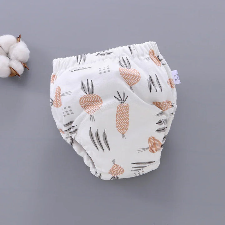 White baby diaper cover with orange and gray carrot print on gray background with cotton plant