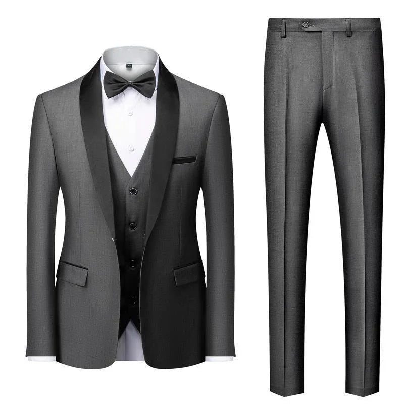 Elegant gray men's tuxedo with black satin shawl lapel, white shirt, black bow tie, vest, and matching pants