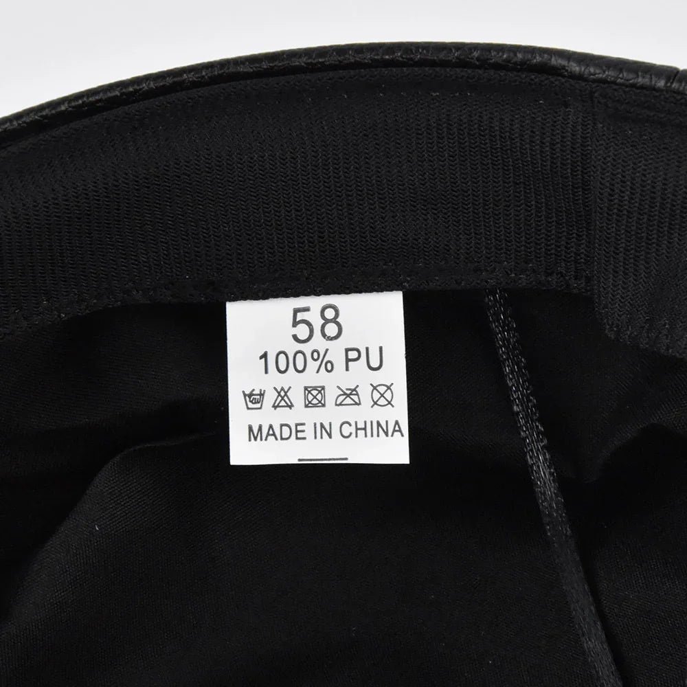 Clothing label inside black garment stating size 58, 100% PU material, made in China, with care symbols