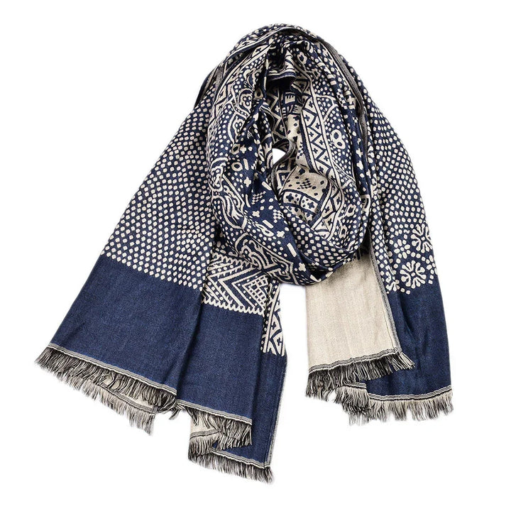 Blue and white patterned scarf with geometric and floral designs, fringed edges