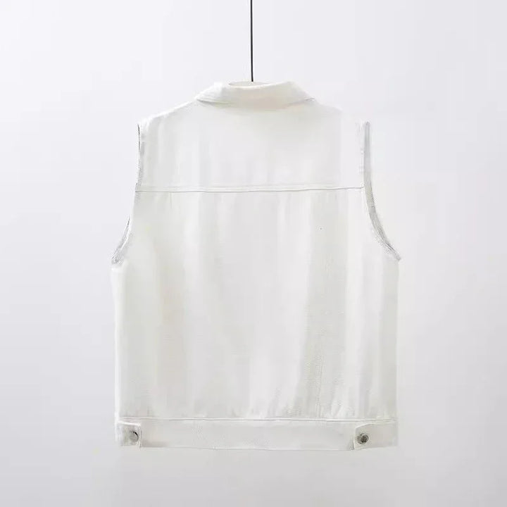 Back view of sleeveless white denim vest hanging against plain white background